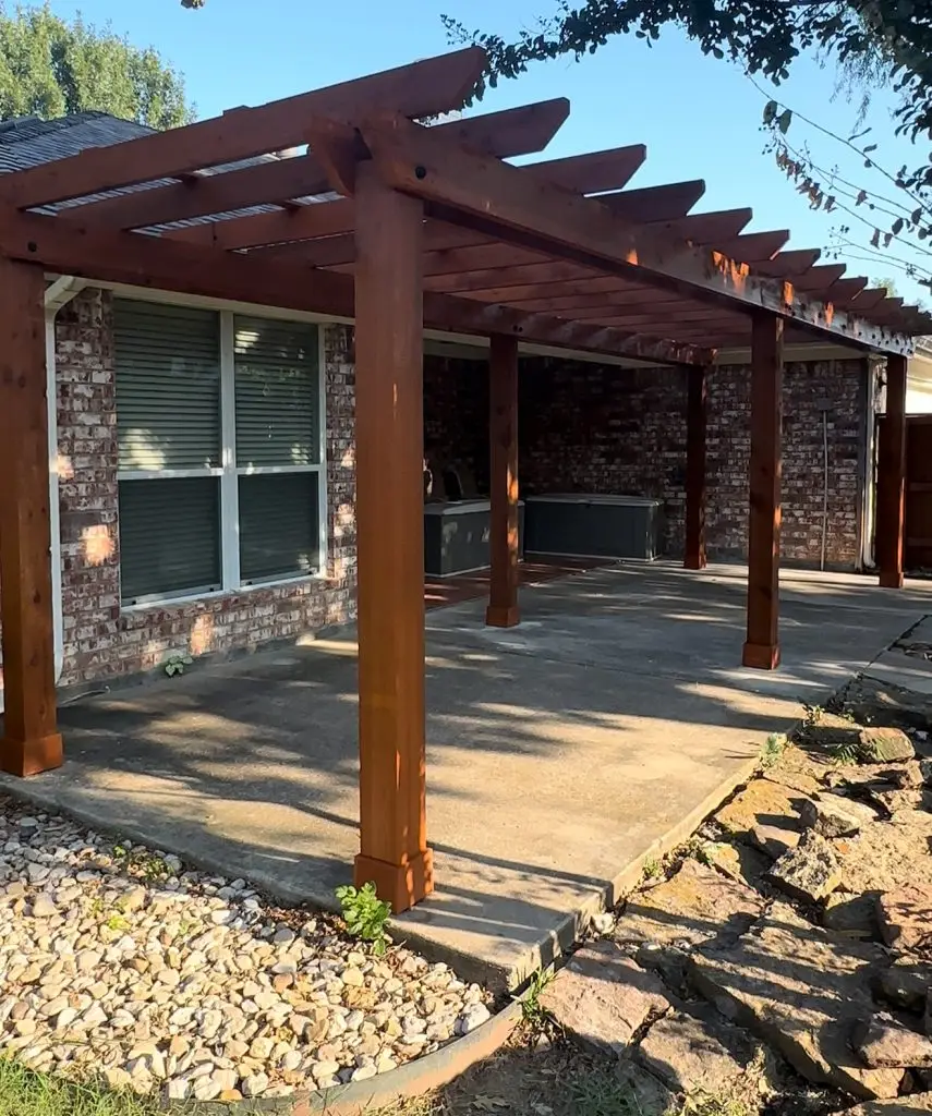 patio builder in texas builds backyard pergola with lattice roof over patio concrete slab by STR Top Construction