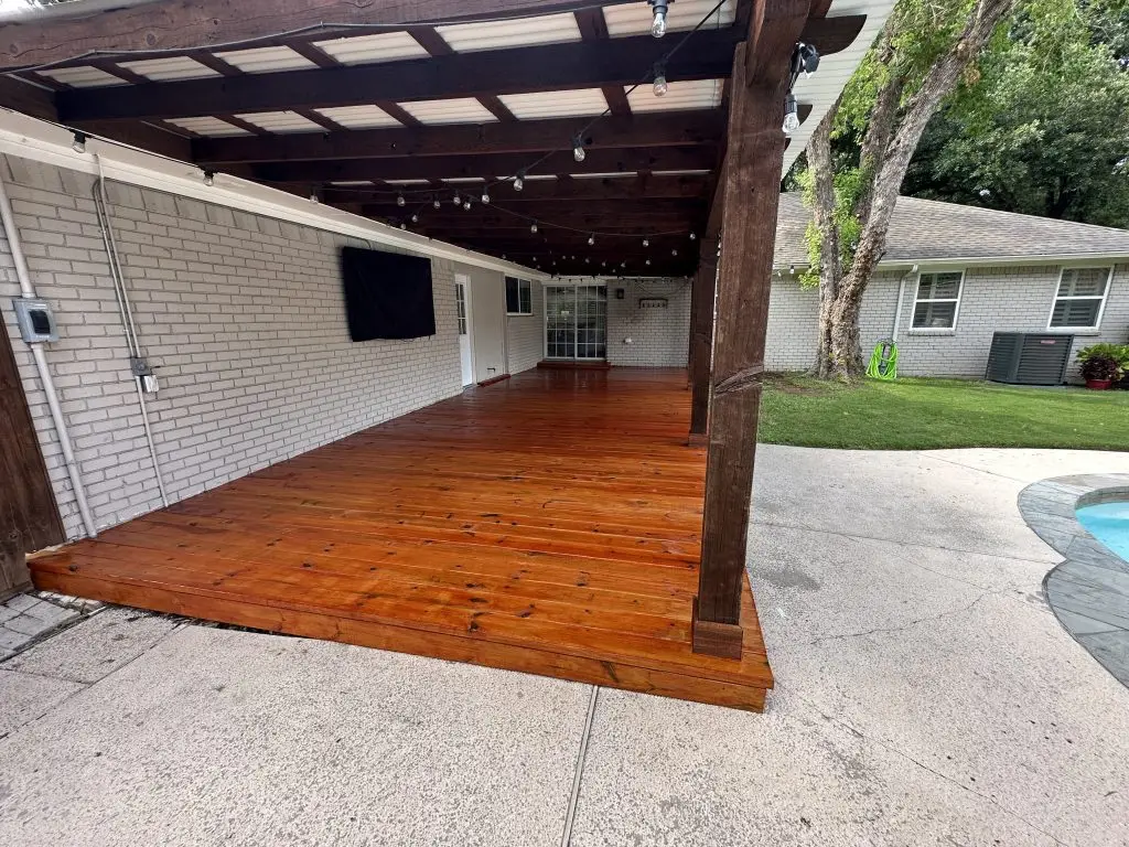 patio contractor in texas builds a poolside patio cover pergola with stained wood deck